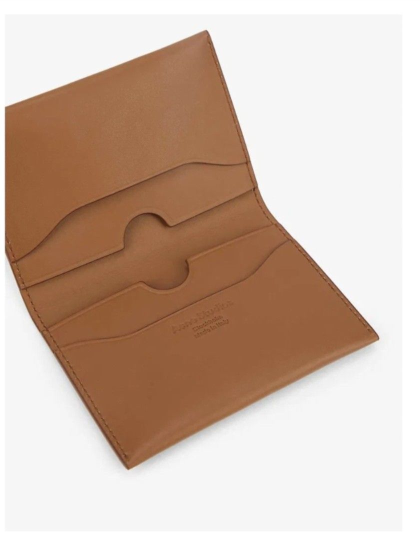 🌸 ACNE STUDIOS Unisex Brand Embossed Card Holder 🌸 (Category: Luxury Bags & Wallets) located in Caloocan City. Submitted by saturday.ph (Listing ID 1465496321, Image 3). Description: Product Details When wandering the streets of Stockholm come winter – where Acne Studios resides – a piping hot glögg and a cardamom bun are sure to tickle your fancy. Complete with four interior card slots and a main inside compartment, this fold-over card holder 