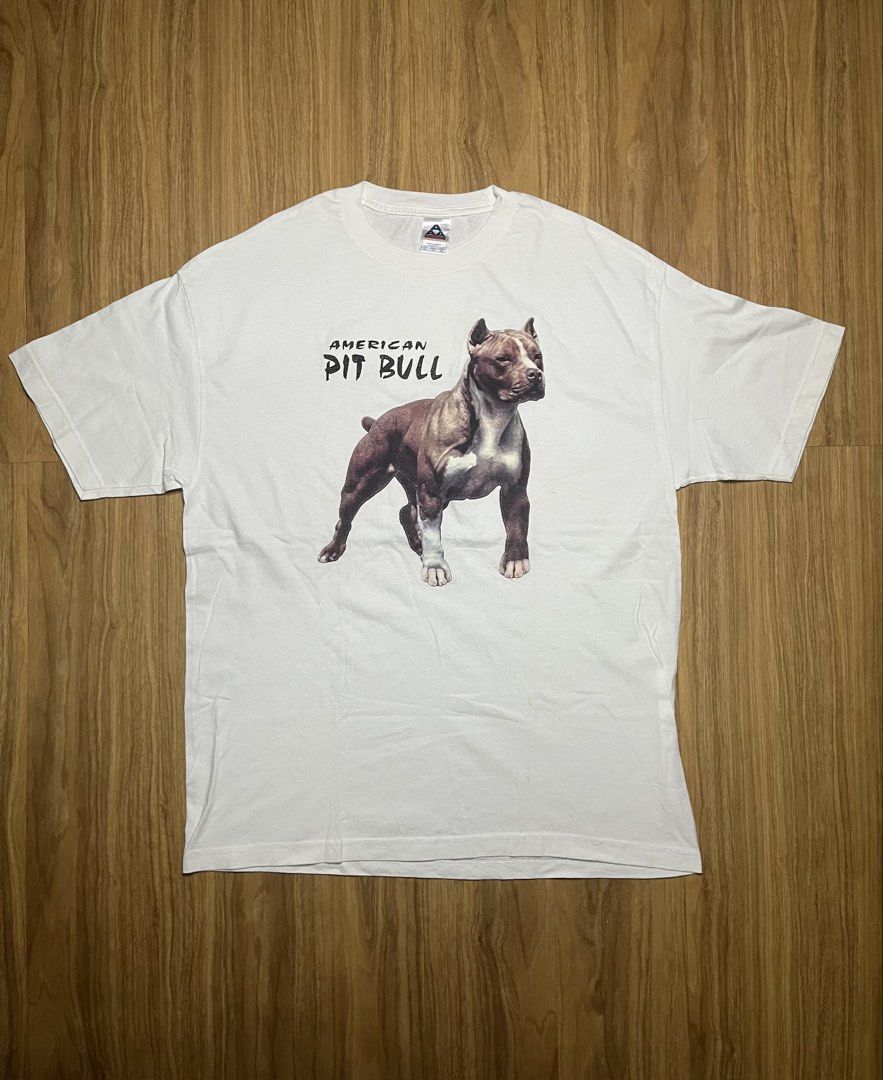 AAA American Pit Bull XL •23x21 (Category: Tshirts & Polo Shirts ) located in Cebu City. Submitted by guttathreads (Listing ID 1465429789, Image 1). Description: - Brand: Alstyle Apparel & Activewear - Design: Detailed American Pit Bull graphic with bold lettering on the chest - Color: Clean white - Size: XL - Origin: Made in Mexico - Style: Standard short sleeve crewneck.