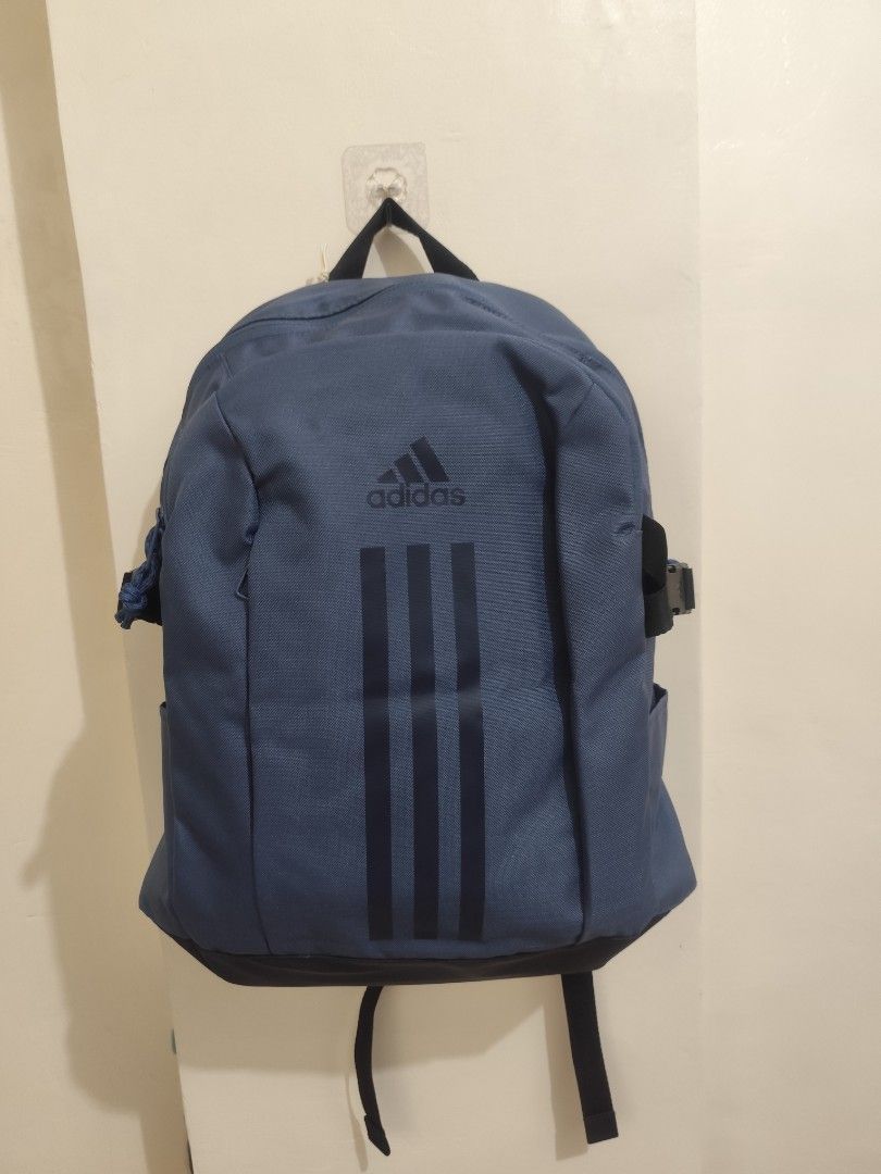 Adidas Blue Backpack (Category: Backpacks) located in Manila. Submitted by deguzmanni82562 (Listing ID 1465418169, Image 3). Description: - Brand new blue Adidas backpack with iconic white three stripes - Features a handy front pocket and roomy main compartment with sturdy zippers - Comfortable black mesh padded shoulder straps for all-day use - Complete with original hang tags attached - Versatile daily bag ideal for school, work, or gym session