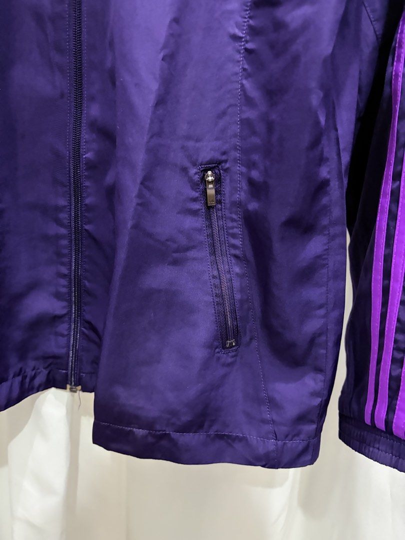 Adidas Climalite Purple Track Jacket (Category: Coats, Jackets and Outerwear) located in General Trias. Submitted by hayami.clo (Listing ID 1465386631, Image 3). Description: - Color: Deep purple with bright purple three-stripe branding - Fit: Women's sizing with embroidered Adidas chest logo - Closure: Full zip front with dual zippered side pockets - Lining: Breathable mesh inner lining throughout - Condition: Excellent, ready to wear.