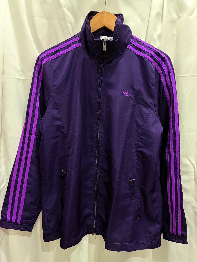 Adidas Climalite Purple Track Jacket (Category: Coats, Jackets and Outerwear) located in General Trias. Submitted by hayami.clo (Listing ID 1465386631, Image 1). Description: - Color: Deep purple with bright purple three-stripe branding - Fit: Women's sizing with embroidered Adidas chest logo - Closure: Full zip front with dual zippered side pockets - Lining: Breathable mesh inner lining throughout - Condition: Excellent, ready to wear.