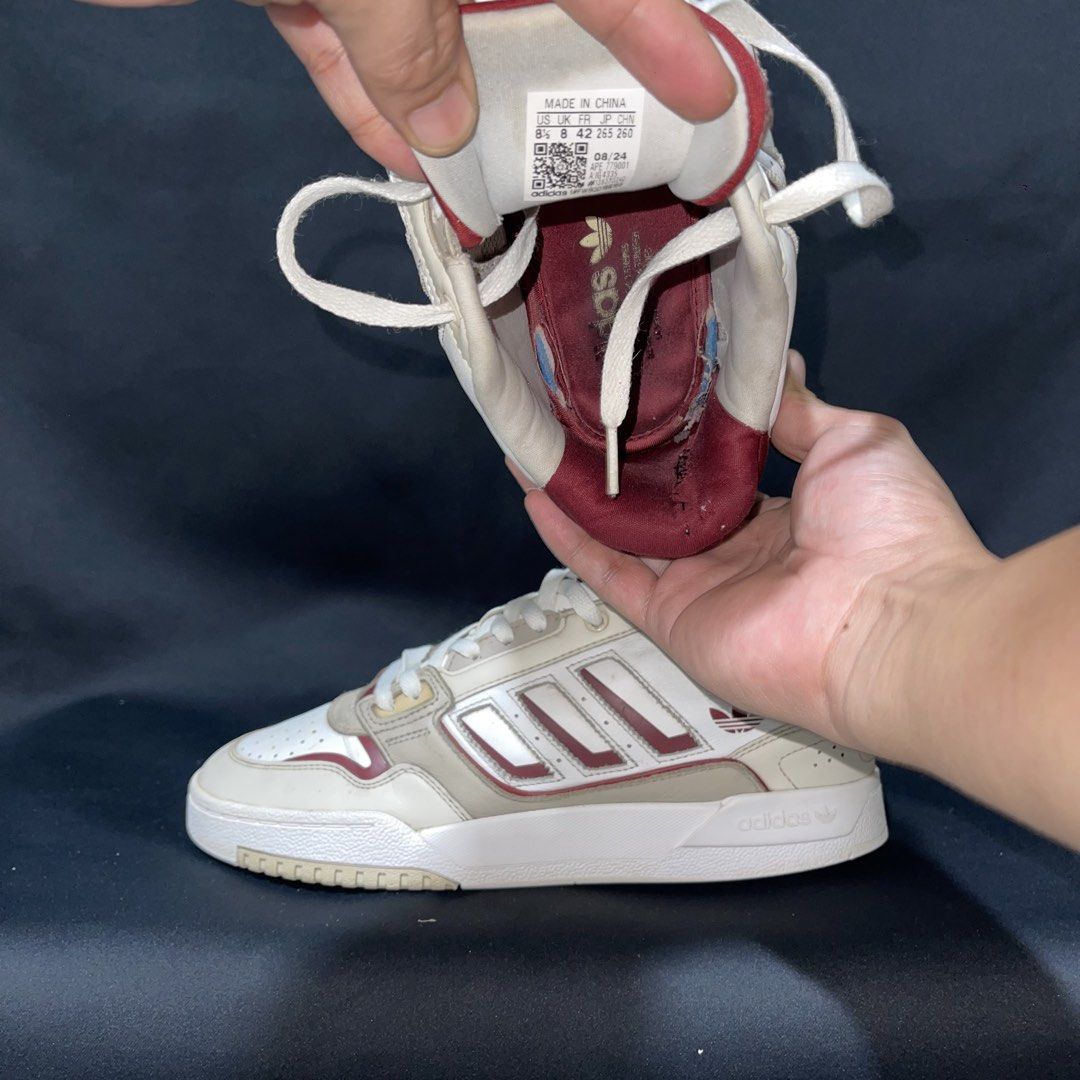 Adidas Drop Step 2.0 CNY US 8.5 (Category: Sneakers) located in Bulacan. Submitted by ogieeee (Listing ID 1465544439, Image 2). Description: - Brand: Adidas - Model: Drop Step 2.0 CNY - Color: White and maroon - Size: US 8.5, EUR 42, CM 26.5 - Style: Chunky basketball-inspired design with classic three stripes.