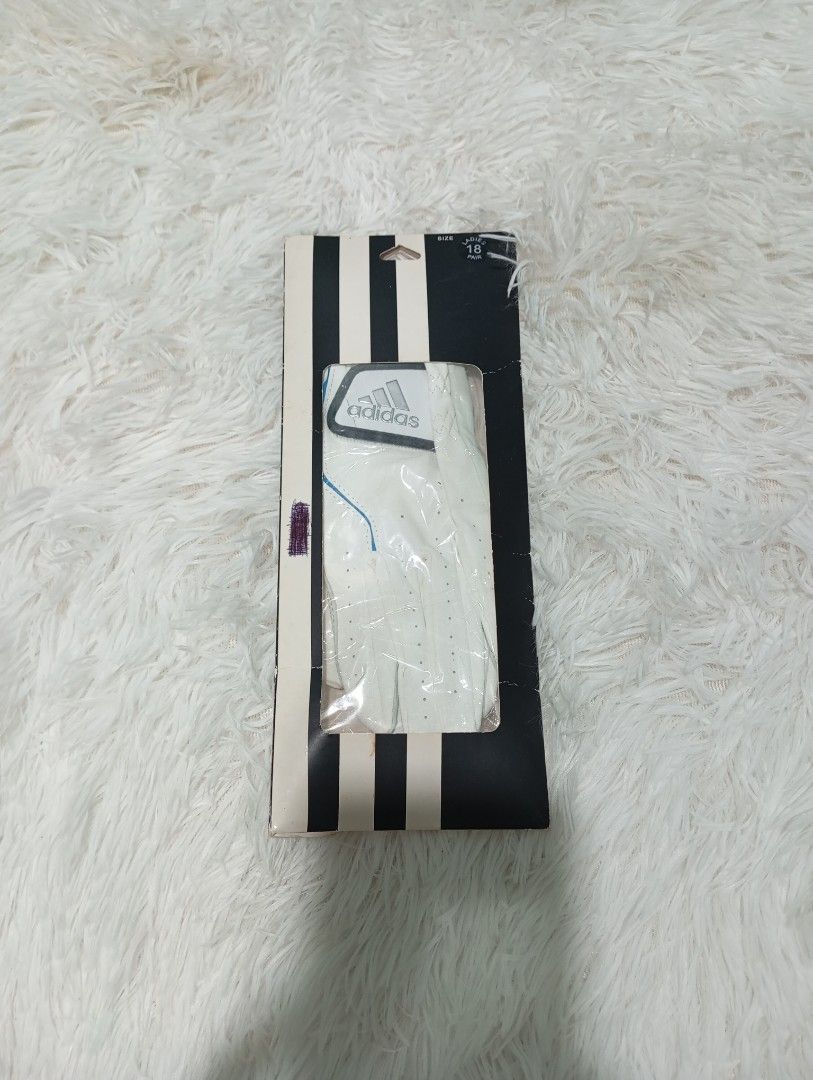 Adidas Golf Glove (Category: Golf) located in Quezon City. Submitted by thesecondmarketph (Listing ID 1465439210, Image 1). Description: - Brand: Adidas - Item: Ladies Golf Glove - Color: White and Blue - Size: 18 - Model: AWL19SGL03 - Material: 53% Polyurethane, 45% Leather, 2% Nylon - Condition: Brand new, unopened in original retail packaging - Manufacturing Date: December 2018.