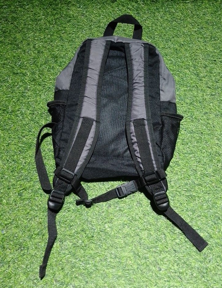 Adidas Mini grey and black backpack with mesh side pockets (Category: Backpacks) located in Manila. Submitted by patrickjos06722 (Listing ID 1465491550, Image 2). Description: - Authentic grey and black Adidas backpack with a stylish geometric pattern - Comfortable padded back panel and adjustable shoulder straps for daily use - Secure chest buckle for added support during commutes - Convenient front zipped pocket and dual side mesh pockets for w