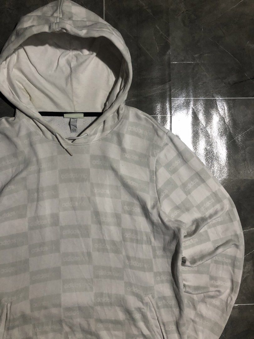 Adidas Neo aop white gray pull over hoodie (Category: Coats, Jackets and Outerwear) located in Manila. Submitted by buksthrifthing (Listing ID 1465434865, Image 1). Description: 23 by 28 large to semi xL No issue Excellent condition as new .