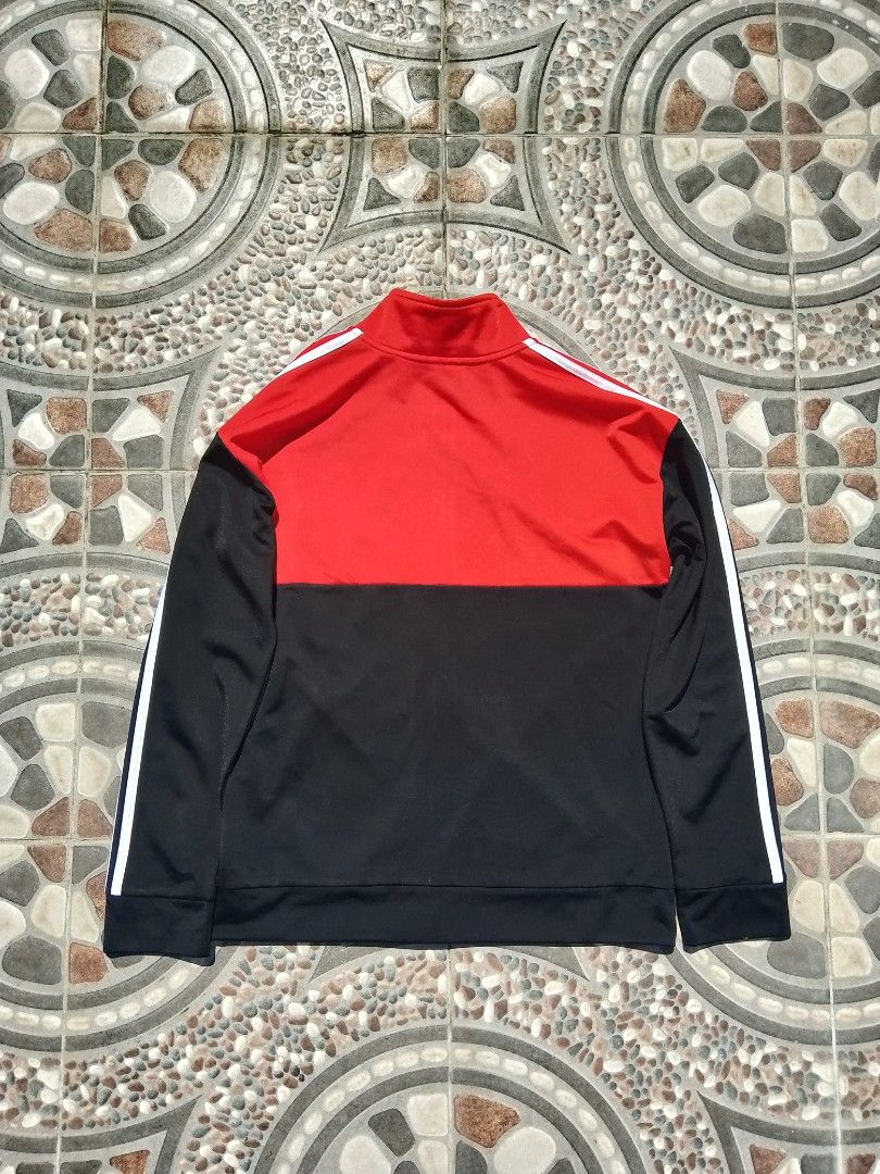 Adidas Red Black Track Jacket (Category: Coats, Jackets and Outerwear) located in Cabuyao City. Submitted by kyokiiiiiii (Listing ID 1465429674, Image 2). Description: - Brand: Adidas - Color: Red, black, and white - Design: Color-blocked with signature white stripes down both sleeves - Features: Full zip front, stand-up collar, ribbed cuffs and hem - Style: Classic athletic streetwear - Condition: Excellent / ready to wear.