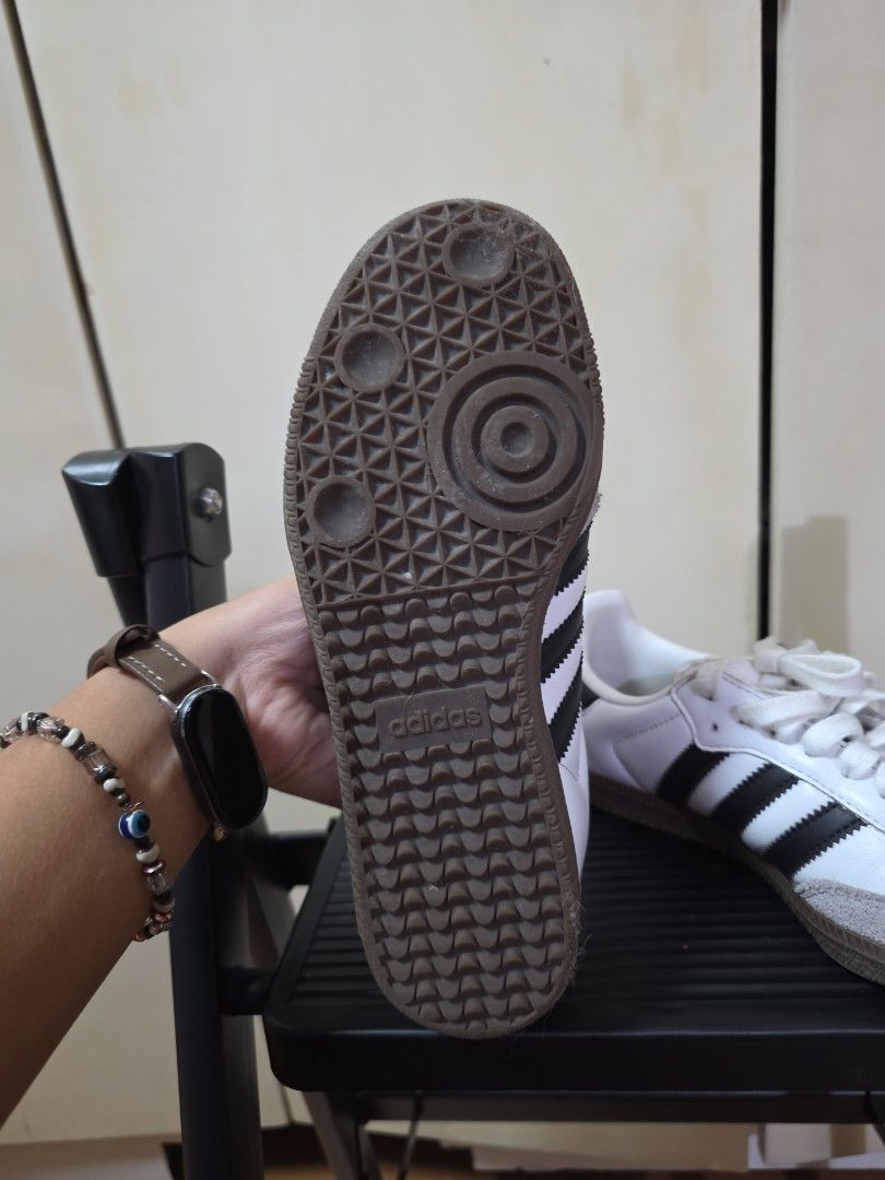 Adidas Samba White Black Leather Sneakers (Category: Sneakers) located in Quezon City. Submitted by buysophie (Listing ID 1465402504, Image 3). Description: - Model: Adidas Samba - Colorway: White leather with classic black stripes and gum soles - Details: Grey suede toe caps and white laces - Style: Iconic retro indoor soccer design, perfect for everyday streetwear rfs: too small on me - Condition: Clean uppers with slight wear on the laces.