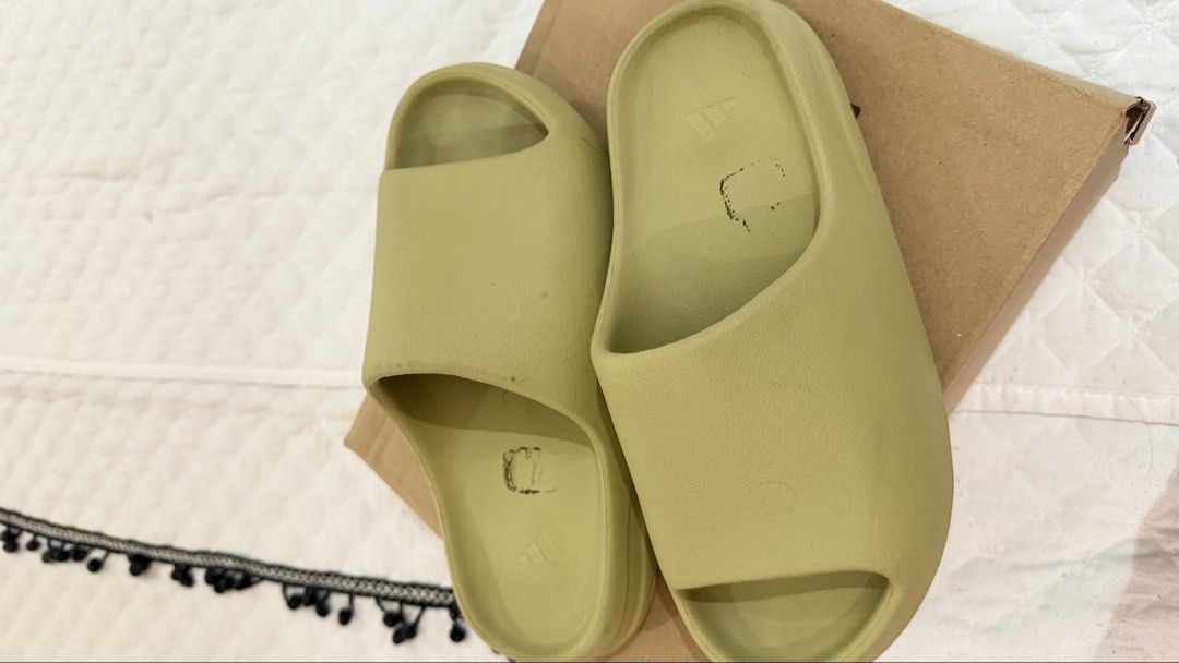 Adidas Yeezy Slide Resinch (Category: Slippers & Slides) located in Mandaluyong City. Submitted by lizbeth031274 (Listing ID 1465429057, Image 2). Description: - Brand: Adidas Yeezy Slides - Colorway: Resin - Size: UK 8 / US 8.5 / CHN 260 - Condition: Worn a few times, minimal wear on soles - Inclusions: Original box and authentic product tags attached - Features: Classic foam build with molded footbed and textured outsole.
