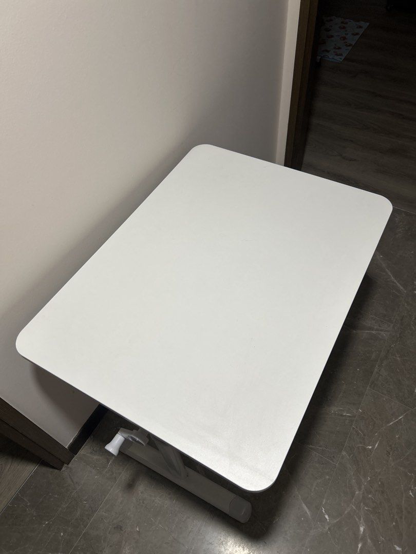 adjustable table (Category: Tables & Sets) located in Singapore. Submitted by cleffairy06 (Listing ID 1465454175, Image 3). Description: White table, nice and sturdy Can be use as a study table, adjustable height .