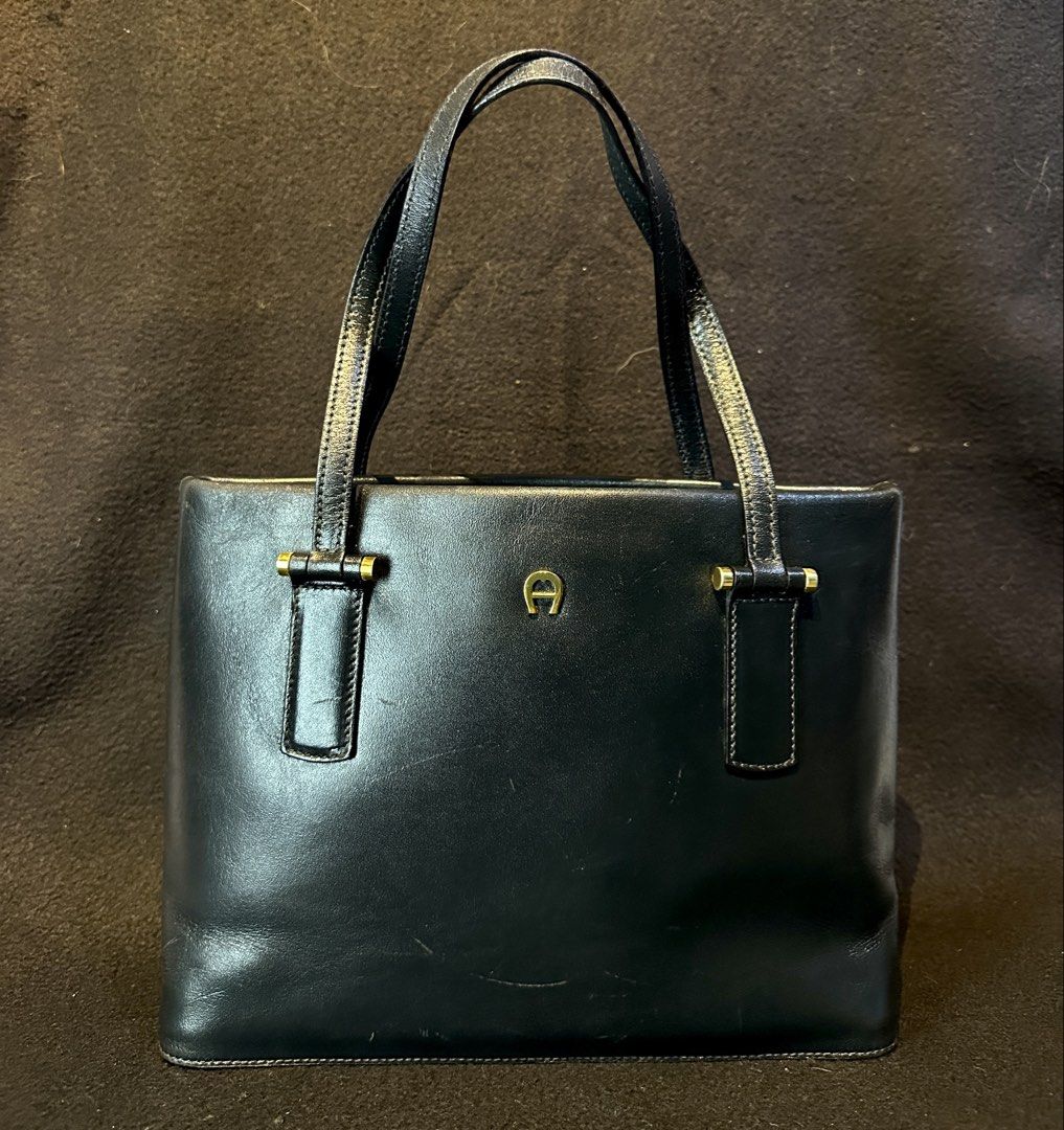AIGNER Genuine Leather Small tote bag (Category: Luxury Bags & Wallets) located in Quezon City. Submitted by WIMC2ndaccount (Listing ID 1465492935, Image 2). Description: Japan bag Vintage bag Genuine leather Normal sign of usage Leather inside Mini tote bag 26 X 20 centimeters .