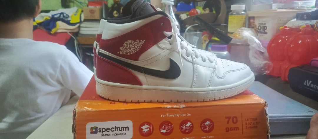 Air Jordan 1 Mid Chicago Black Toe (Category: Dress Shoes) located in Manila. Submitted by calditocas36230 (Listing ID 1465519975, Image 3). Description: - Model: Air Jordan 1 Mid - Colorway: Chicago Black Toe (White leather base, black swooshes, red overlays) - Branding: Red Jumpman logo on tongue tags - Details: White laces and clean white rubber outsoles - Condition: Minor creasing on toe boxes from normal wear - 100% authentic and well-mainta
