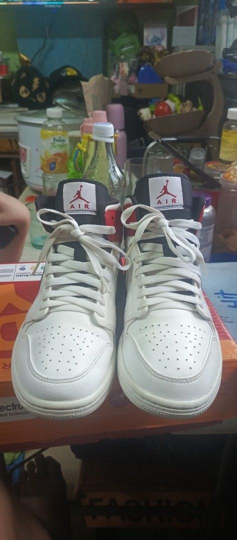 Air Jordan 1 Mid Chicago Black Toe (Category: Dress Shoes) located in Manila. Submitted by calditocas36230 (Listing ID 1465519975, Image 2). Description: - Model: Air Jordan 1 Mid - Colorway: Chicago Black Toe (White leather base, black swooshes, red overlays) - Branding: Red Jumpman logo on tongue tags - Details: White laces and clean white rubber outsoles - Condition: Minor creasing on toe boxes from normal wear - 100% authentic and well-mainta