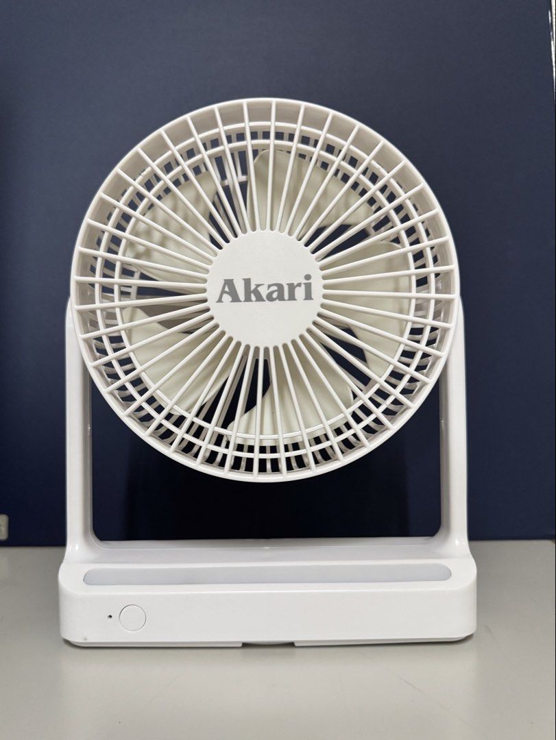 Akari Multi Mount Fan ARF-MF01W White (Category: Fans) located in Makati City. Submitted by avic_c (Listing ID 1465402998, Image 1). Description: - Brand: Akari Multi Mount Fan (Model: ARF-MF01W) - Condition: Working condition, well-maintained - Power: 3.7V 1200mAh lithium battery & 5V DC power with USB charging port - Design: Compact and portable in clean white - Versatile: Features a built-in wall mount bracket and hanging hook for easy placeme