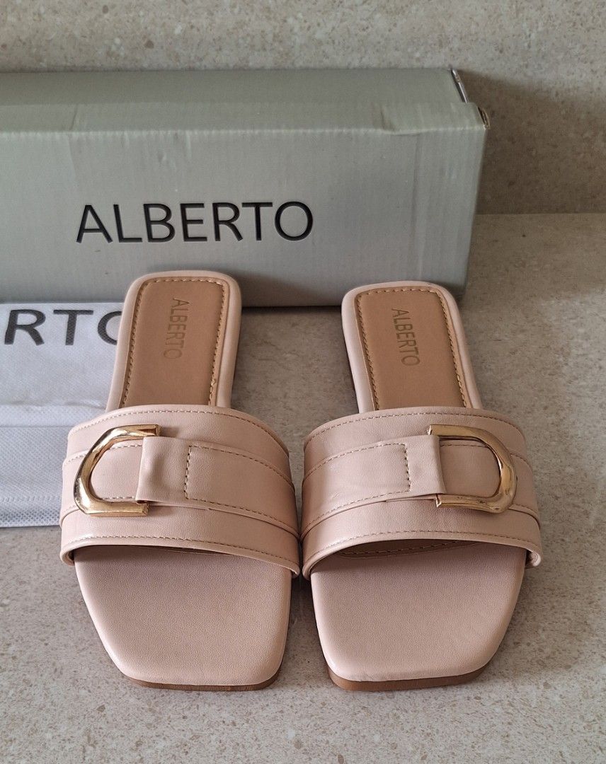 Alberto Avi Slip-On Sandals (Category: Flats & Sandals) located in Naic. Submitted by blikitiplix (Listing ID 1465459655, Image 2). Description: - Brand: Alberto (Style: Avi) - Color: Beige - Size: 37 EU / 6 US - Condition: Brand new, never worn (Pristine condition) - Details: Square toe, gold-tone front buckle strap, flat heel, textured rubber sole - Inclusions: Original branded box and dust bag.