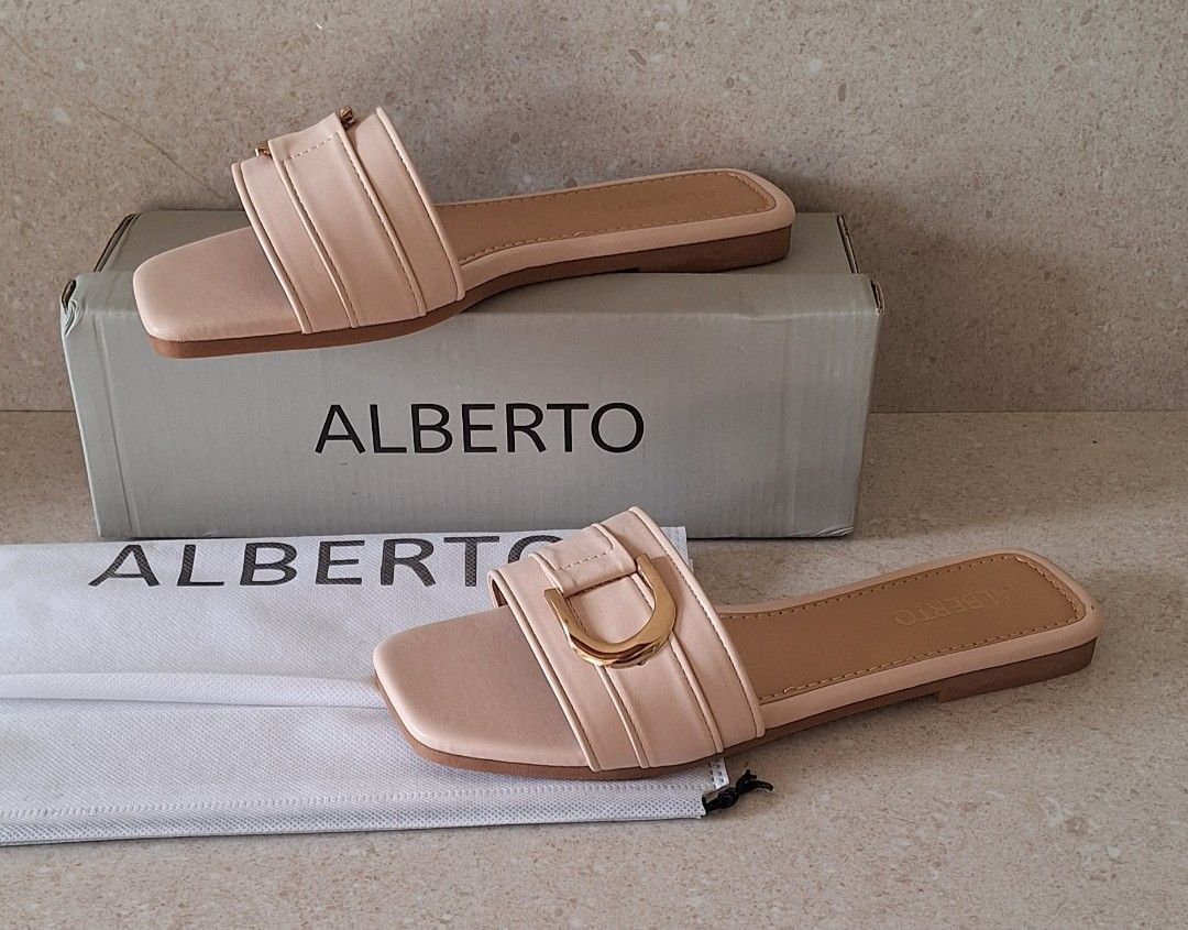 Alberto Avi Slip-On Sandals (Category: Flats & Sandals) located in Naic. Submitted by blikitiplix (Listing ID 1465459655, Image 1). Description: - Brand: Alberto (Style: Avi) - Color: Beige - Size: 37 EU / 6 US - Condition: Brand new, never worn (Pristine condition) - Details: Square toe, gold-tone front buckle strap, flat heel, textured rubber sole - Inclusions: Original branded box and dust bag.
