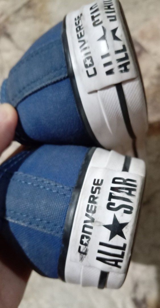 All Star Blue Low Top Sneakers (Category: Sneakers) located in Quezon City. Submitted by chacha30.s (Listing ID 1465492114, Image 2). Description: - Brand: Converse - Style: Low top canvas sneakers - Color: Blue with white toe caps and brown outsoles - Features: Upgraded with metal magnetic shoelace buckles for easy wear - Branding: Classic All Star logo on heels and insoles - Condition: Light signs of wear on soles and fabrc . Text me at 0927715
