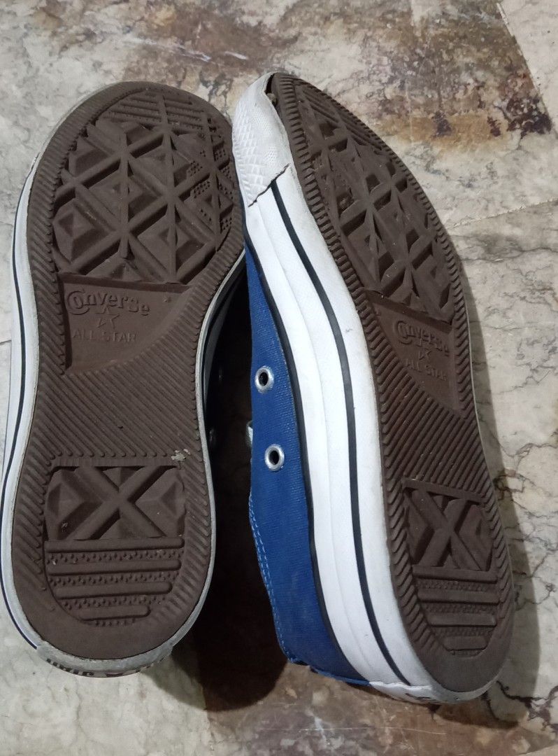 All Star Blue Low Top Sneakers (Category: Sneakers) located in Quezon City. Submitted by chacha30.s (Listing ID 1465492114, Image 3). Description: - Brand: Converse - Style: Low top canvas sneakers - Color: Blue with white toe caps and brown outsoles - Features: Upgraded with metal magnetic shoelace buckles for easy wear - Branding: Classic All Star logo on heels and insoles - Condition: Light signs of wear on soles and fabrc . Text me at 0927715