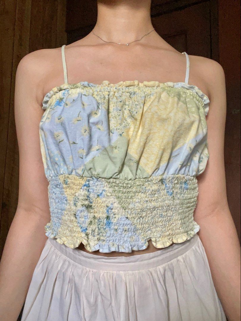 American Eagle Floral Patchwork Smocked Tube Top (Category: Sleeveless) located in Antipolo. Submitted by jazzminex (Listing ID 1465534694, Image 1). Description: - Brand: American Eagle - Style: Floral patchwork tube top with adjustable thin straps - Colors: Pastel yellow, blue, and green - Fit & Comfort: Stretchy smocked midsection, size XS (fits true to size), lightweight fabric .