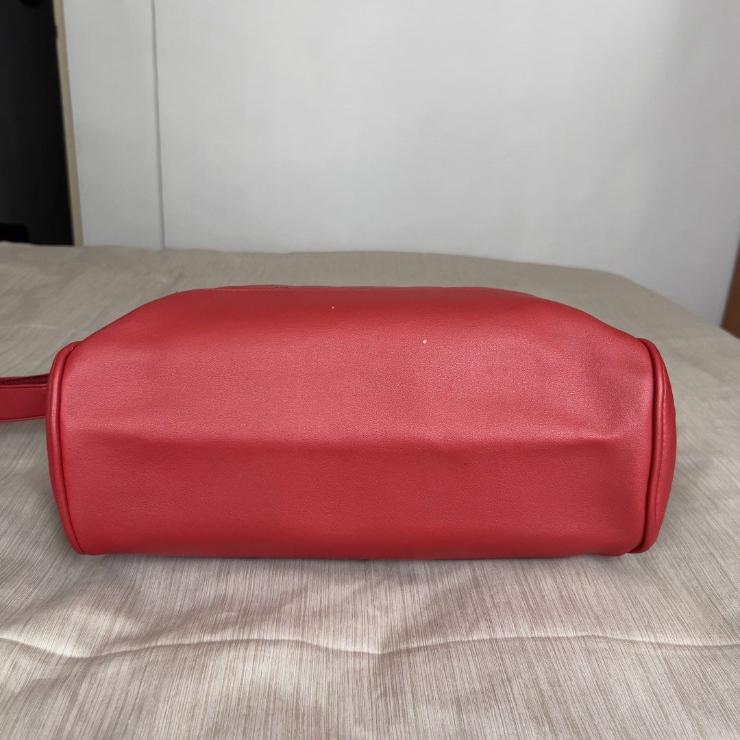 ANELLO 2-Way Boston Quilted Red Shoulder Bag (Category: Shoulder Bags) located in Pasig City. Submitted by jenscloset86 (Listing ID 1465414031, Image 3). Description: Brand: ANELLO • Vibrant red faux leather with gold-tone hardware. • Overall is excellent condition with some wear and tear as shown in photos. • Clean interior and exterior, well-maintained. Measurement (in inches): Height: 11.5” Length: 17” Bottom width: 5”.