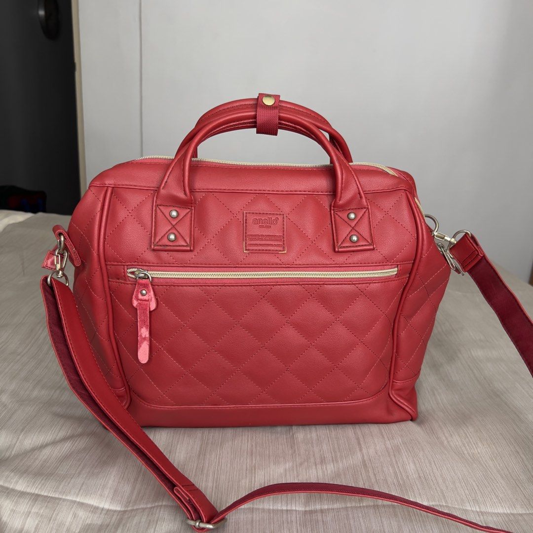 ANELLO 2-Way Boston Quilted Red Shoulder Bag (Category: Shoulder Bags) located in Pasig City. Submitted by jenscloset86 (Listing ID 1465414031, Image 1). Description: Brand: ANELLO • Vibrant red faux leather with gold-tone hardware. • Overall is excellent condition with some wear and tear as shown in photos. • Clean interior and exterior, well-maintained. Measurement (in inches): Height: 11.5” Length: 17” Bottom width: 5”.