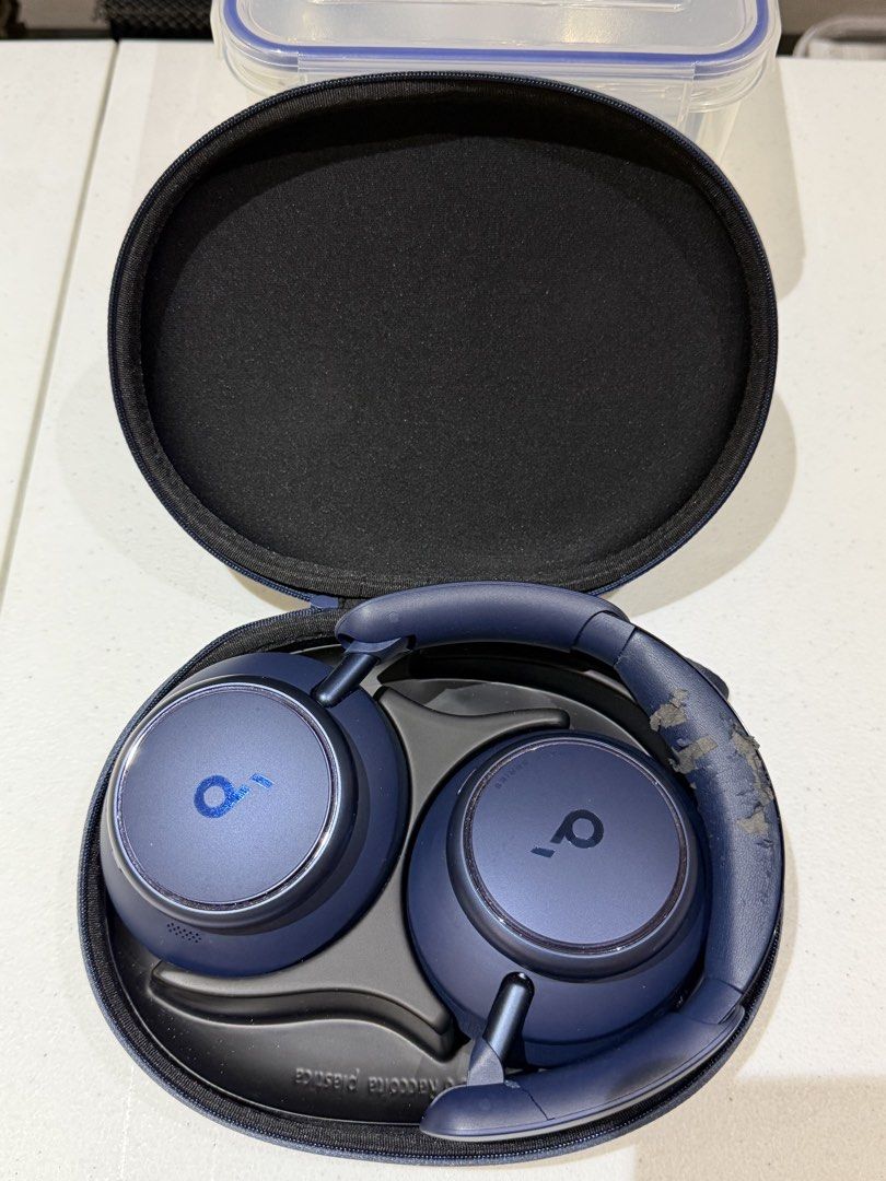Anker Soundcore Space One Headphones (Category: Headphones & Headsets) located in Quezon City. Submitted by zyllus30 (Listing ID 1465493258, Image 3). Description: - Model: Anker Soundcore Space One Over-Ear Headphones - Color: Navy Blue - Condition: Fully functional audio and Active Noise Cancelling (ANC), but with heavy peeling/flaking on the synthetic leather ear pads and headband padding - Inclusions: Original hard carrying case, audio cable,