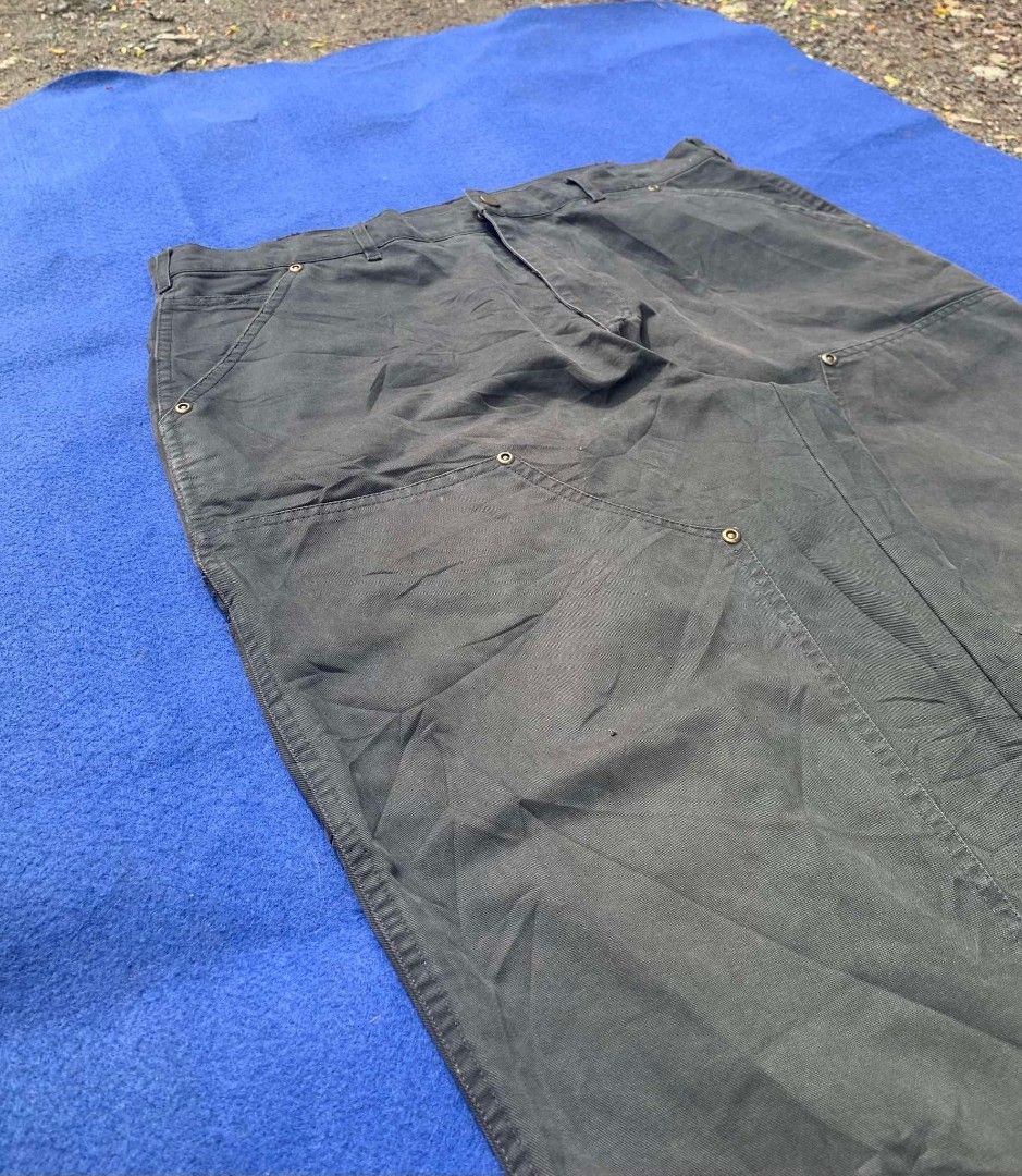 Annone's Dark Grey Double Knee Carpenter Pants (Category: Jeans) located in Cebu City. Submitted by brightcrystal-fe18c1 (Listing ID 1465388643, Image 2). Description: - Brand: Annone - Color: Dark Grey - Material: Heavy-duty duck canvas - Fit: Relaxed fit through the legs - Details: Double knee panels, multiple utility pockets, and hammer loop - Hem: Raw hem with minor fraying at bottom cuffs - Style: Streetwear / Workwear aesthetic.