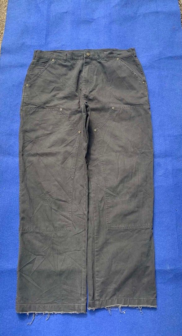Annone's Dark Grey Double Knee Carpenter Pants (Category: Jeans) located in Cebu City. Submitted by brightcrystal-fe18c1 (Listing ID 1465388643, Image 1). Description: - Brand: Annone - Color: Dark Grey - Material: Heavy-duty duck canvas - Fit: Relaxed fit through the legs - Details: Double knee panels, multiple utility pockets, and hammer loop - Hem: Raw hem with minor fraying at bottom cuffs - Style: Streetwear / Workwear aesthetic.