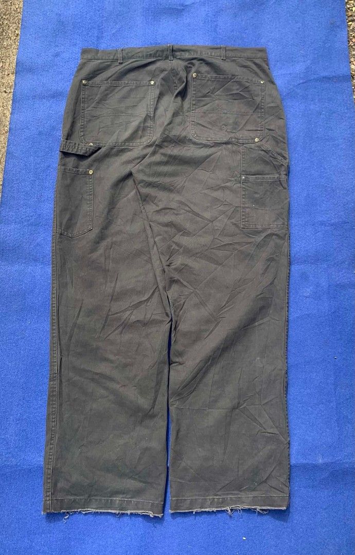 Annone's Dark Grey Double Knee Carpenter Pants (Category: Jeans) located in Cebu City. Submitted by brightcrystal-fe18c1 (Listing ID 1465388643, Image 3). Description: - Brand: Annone - Color: Dark Grey - Material: Heavy-duty duck canvas - Fit: Relaxed fit through the legs - Details: Double knee panels, multiple utility pockets, and hammer loop - Hem: Raw hem with minor fraying at bottom cuffs - Style: Streetwear / Workwear aesthetic.