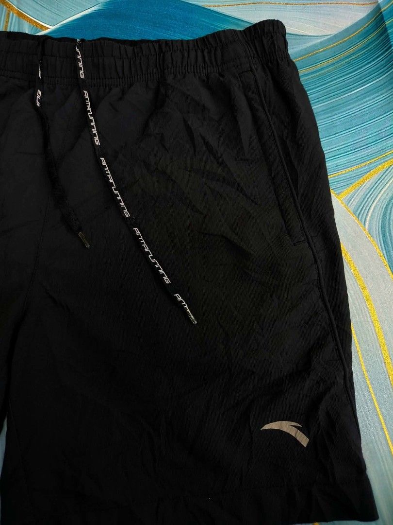 Anta Running Shorts Black Size L (Category: Shorts) located in Manila. Submitted by virgiliosa38485 (Listing ID 1465500607, Image 2). Description: - Brand: Anta - Color: Classic Black - Size: L (170/80A) -Waist 32-40 -Length 16 - Material: Breathable athletic fabric for maximum comfort - Features: Elastic waistband with branded drawstring and two convenient side pockets - Design: Subtle Anta logo printed near the left hem - Condition: Good overal
