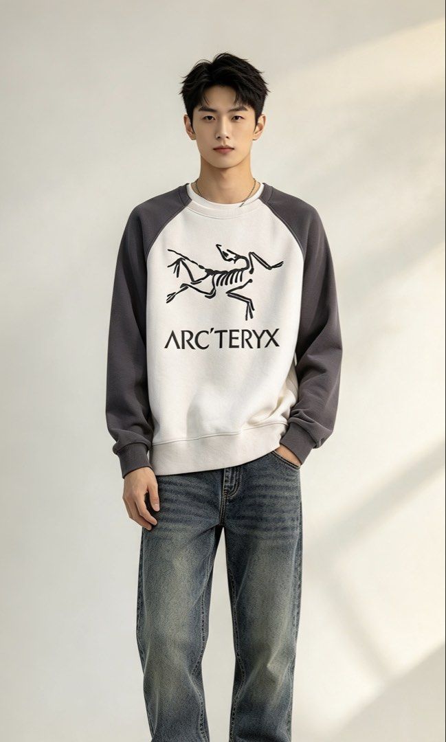 Arc'teryx Two-Tone Raglan Sweatshirt (Category: Coats, Jackets and Outerwear) located in Paranaque City. Submitted by mykapoynton (Listing ID 1465541331, Image 1). Description: Arc’teryx Two-Tone Raglan Sweatshirt - Style: Raglan sleeve sweatshirt with standard fit - Color: White body with dark grey sleeves - Design: Large skeletal graphic and brand text on front - Materials: 86% nylon, 14% elastane - Details: Ribbed crewneck, cuffs, and hem; mac