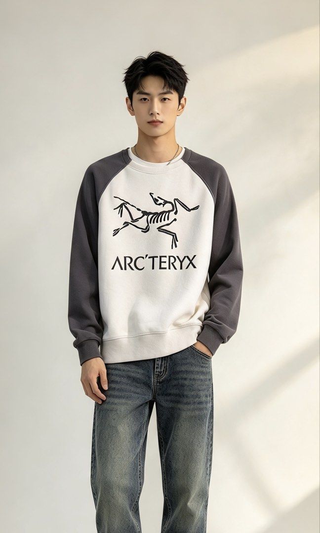 Arc’teryx Two-Tone Raglan Sweatshirt (Category: Coats, Jackets and Outerwear) located in Paranaque City. Submitted by preluxeshop_ph (Listing ID 1465558603, Image 1). Description: Arc’teryx Two-Tone Raglan Sweatshirt - Style: Raglan sleeve sweatshirt with standard fit - Color: White body with dark grey sleeves - Design: Large skeletal graphic and brand text on front - Materials: 86% nylon, 14% elastane - Details: Ribbed crewneck, cuffs, and hem; 