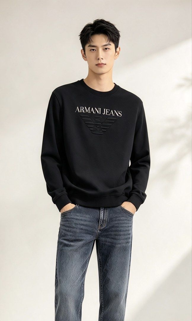 Armani Jeans Black Logo Sweatshirt Size M (Category: Tshirts & Polo Shirts ) located in Paranaque City. Submitted by preluxeshop_ph (Listing ID 1465558885, Image 1). Description: Armani Jeans Black Logo Sweatshirt Size M - Color: Solid Black - Size: Medium (M) - Material: 100% Cotton (Made in Thailand) - Design: Classic crewneck, long sleeves, large embroidered text and eagle logo on chest - Details: Ribbed collar, cuffs, and hem; plain back - Co