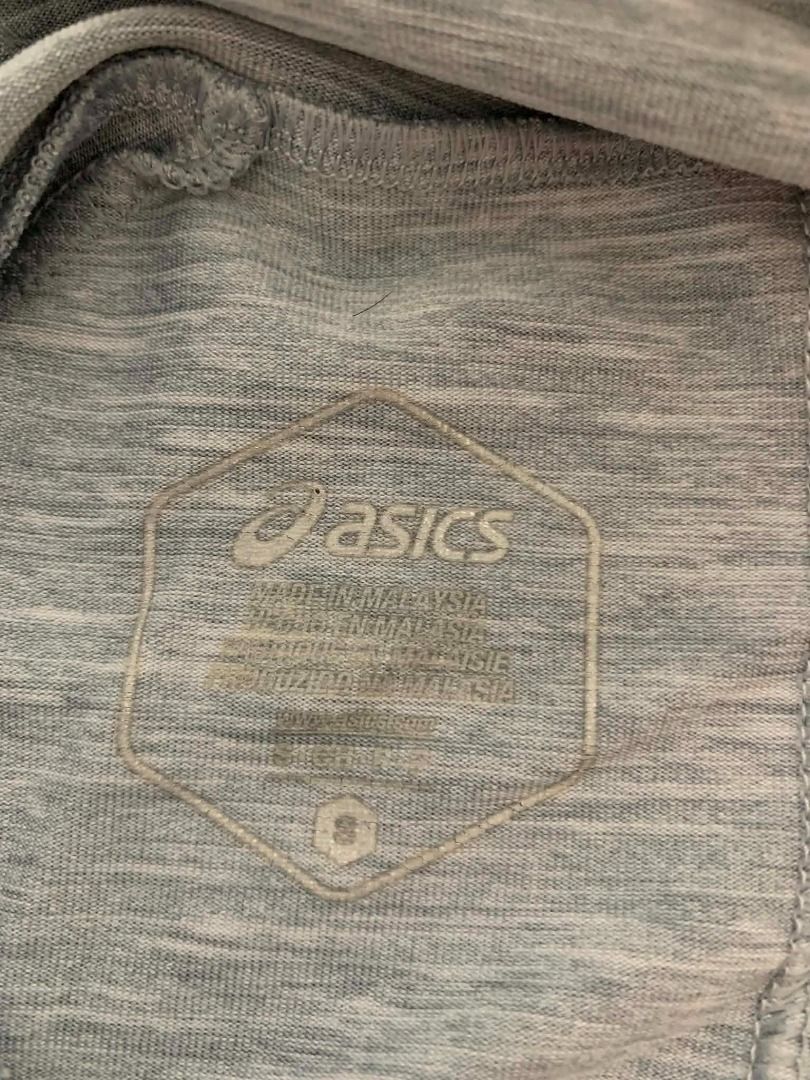 Asics Grey Marled Long Sleeve Activewear Top (Category: Coats, Jackets and Outerwear) located in Manila. Submitted by musedeclutters (Listing ID 1465513105, Image 2). Description: - Brand: Asics - Color: Grey marled - Material: 92% polyester, 8% spandex (lightweight and stretchy) - Features: Long sleeves with thumbholes, subtle logo near hem - Care: Machine washable at 40 degrees - Style Number: 153385 - Washed and properly stored before posting 