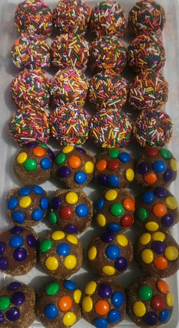 Assorted Chocolate Truffles Box Assorted Toppings (Category: Homemade Bakes) located in Manila. Submitted by swift_maxene4 (Listing ID 1465533611, Image 1). Description: Box of freshly made homemade chocolate truffles featuring a variety of toppings like sprinkles, M&Ms, chocolate chips, crushed biscuits, powdered sugar, and marshmallows. Perfect for sharing, gifting, or treating yourself. Ready to eat!.