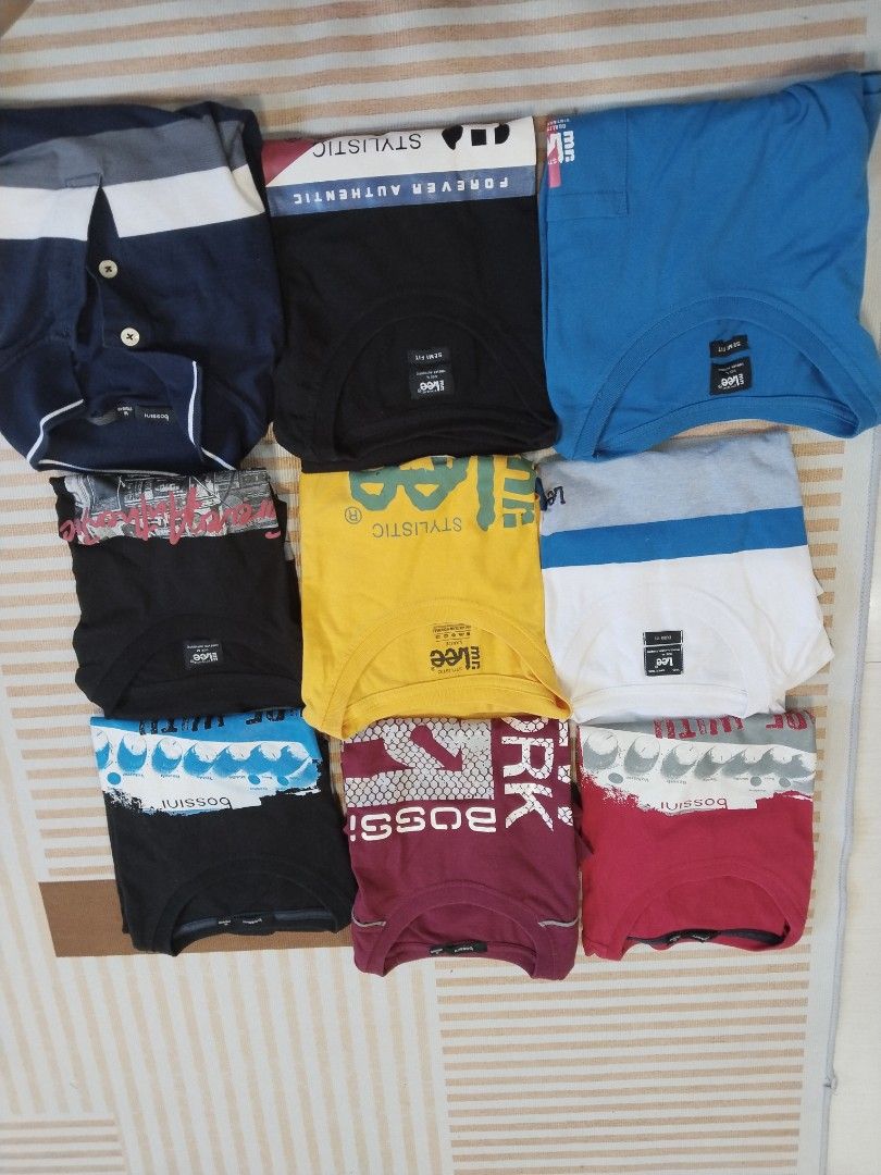 Assorted Lee and Bossini T-shirts and Polo bundle (Category: Tshirts & Polo Shirts ) located in Manila. Submitted by polding25 (Listing ID 1465386089, Image 2). Description: - Total of 9 folded tops including t-shirts and a polo shirt - Trusted brands: Lee and Bossini - Assorted colors: black, blue, yellow, white, maroon - Features various graphic prints and text designs - Mixed sizes included - Great rotation for casual everyday wear - Selling s