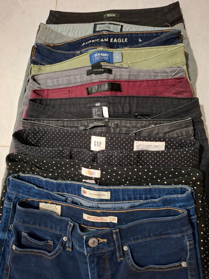Assorted OG Women Jeans (Category: Jeans) located in Caloocan City. Submitted by andiyelikaaa (Listing ID 1465398359, Image 1). Description: Bundle TAKE ALL! 12pcs Assorted jeans from brands like Levi's, Gap, American Eagle, Old Navy, H&M, and Forever 21. Various sizes included from 25 up to 27 waistline. Different styles like super skinny and shaping fits. Colors range from dark blue denim, grey, black, olive green, burgundy, and polka dot patte