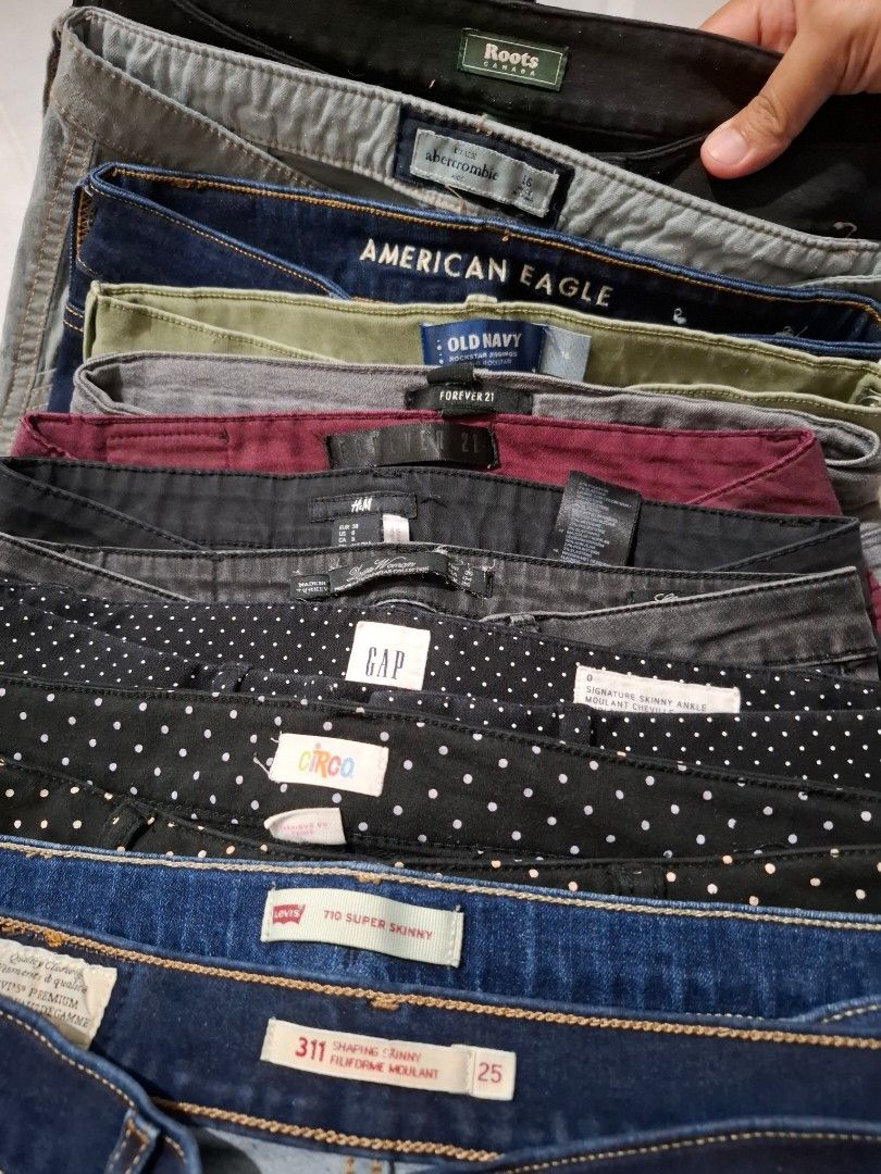 Assorted OG Women Jeans (Category: Jeans) located in Caloocan City. Submitted by andiyelikaaa (Listing ID 1465398359, Image 2). Description: Bundle TAKE ALL! 12pcs Assorted jeans from brands like Levi's, Gap, American Eagle, Old Navy, H&M, and Forever 21. Various sizes included from 25 up to 27 waistline. Different styles like super skinny and shaping fits. Colors range from dark blue denim, grey, black, olive green, burgundy, and polka dot patte