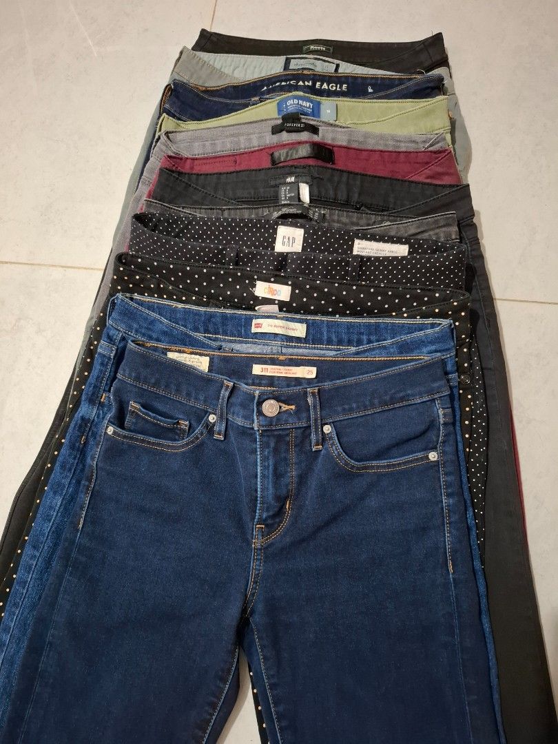 Assorted OG Women Jeans (Category: Jeans) located in Caloocan City. Submitted by andiyelikaaa (Listing ID 1465398359, Image 3). Description: Bundle TAKE ALL! 12pcs Assorted jeans from brands like Levi's, Gap, American Eagle, Old Navy, H&M, and Forever 21. Various sizes included from 25 up to 27 waistline. Different styles like super skinny and shaping fits. Colors range from dark blue denim, grey, black, olive green, burgundy, and polka dot patte
