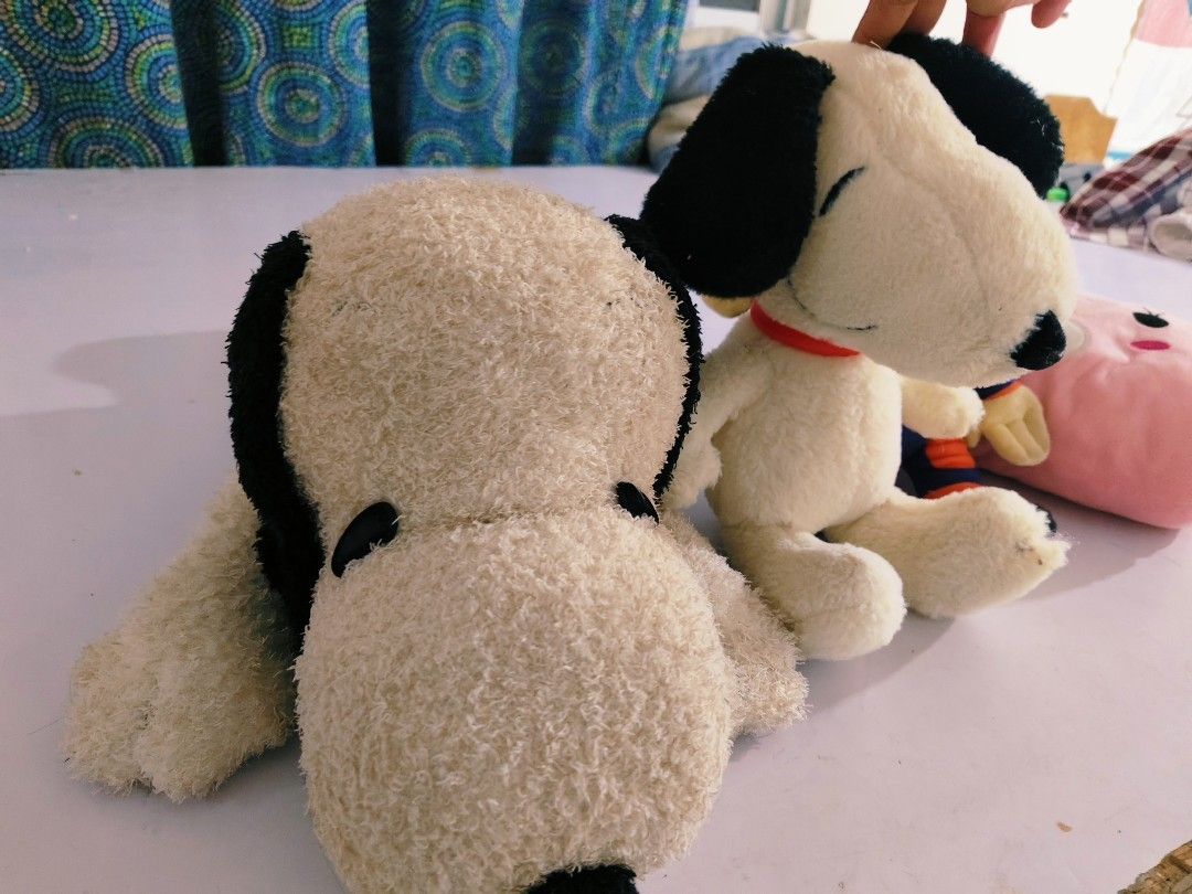 Assorted Stuffed Toy Bundle Snoopy Monkey Pink Bear (Category: Plushies & Soft Toys) located in Bulacan. Submitted by babz30261 (Listing ID 1465493213, Image 1). Description: Bundle of three plush toys. Includes a Snoopy plush, a monkey in a blue and orange suit, and a pink cylindrical bear pillow with small red ears. Soft plush material on all three. Clean and well stored. Great for kids, collectors, or room decor. Sold together as a set..