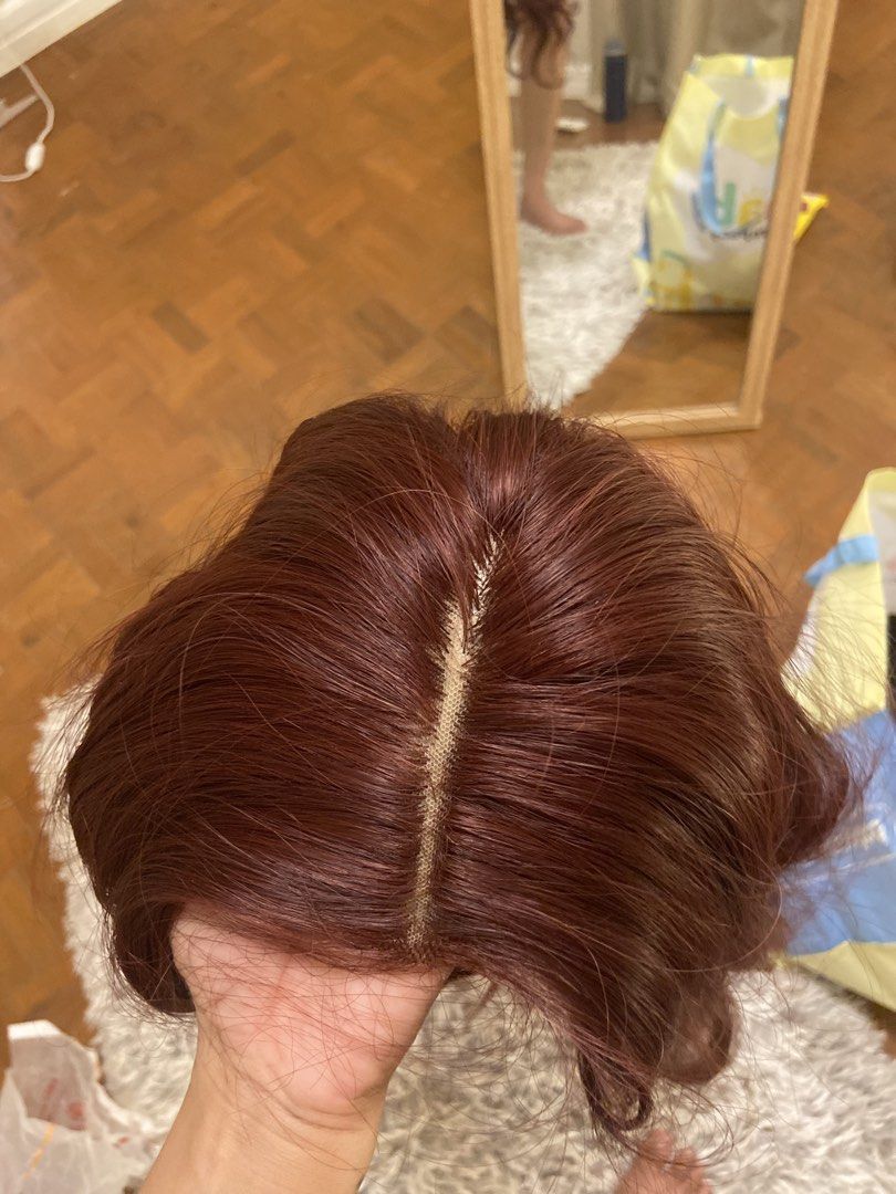 Auburn Red Wavy Lace Part Wig (Category: Hair Accessories) located in Manila. Submitted by charleneka32549 (Listing ID 1465437790, Image 2). Description: Auburn red synthetic wig with long wavy ends and soft curls. Features a lace part at the top for a natural scalp look. Inner mesh cap is adjustable and lightweight. Easy to wear for everyday styles or costume parties..