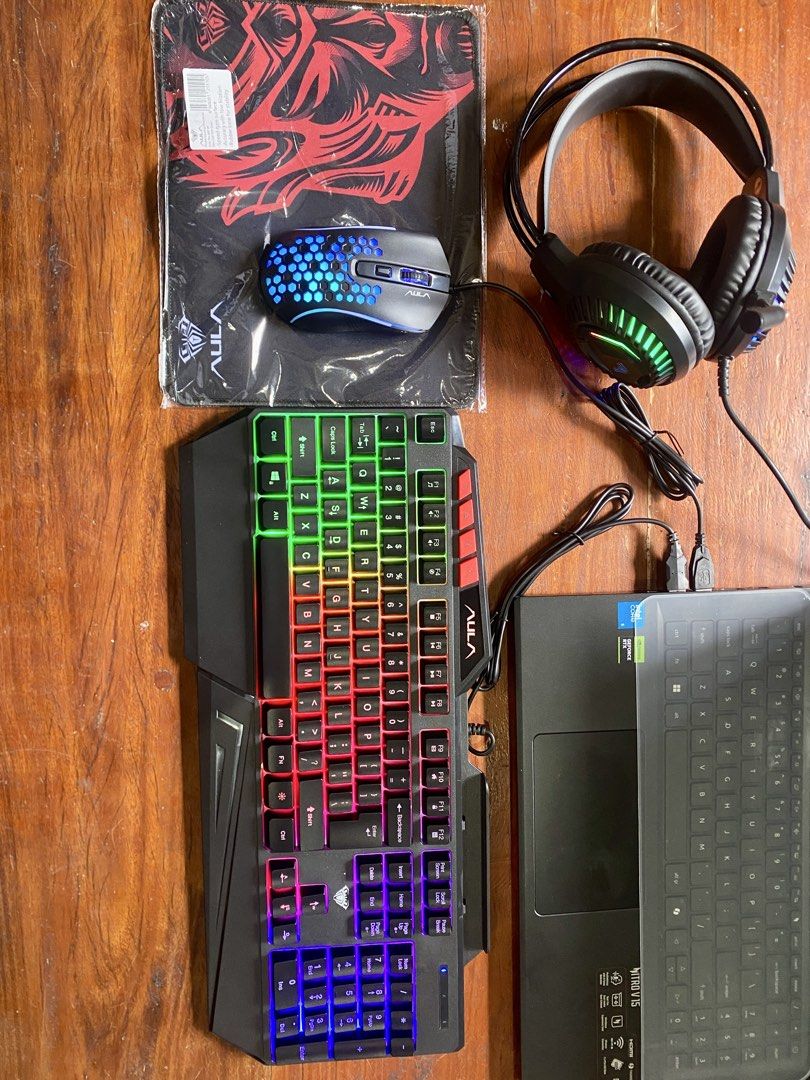 Aula T650 4 in 1 combo (Category: Computer Keyboard) located in Amadeo. Submitted by shop.and.stack (Listing ID 1465409890, Image 1). Description: The AULA T650 4-in-1 Combo is a budget-friendly wired gaming/PC peripheral set that includes keyboard + mouse + headset + mousepad. It’s particularly useful if you’re building a complete setup without buying each accessory separately. Component ⌨️ Keyboard 104/108-key membrane keyboard, rainbow RGB/bac