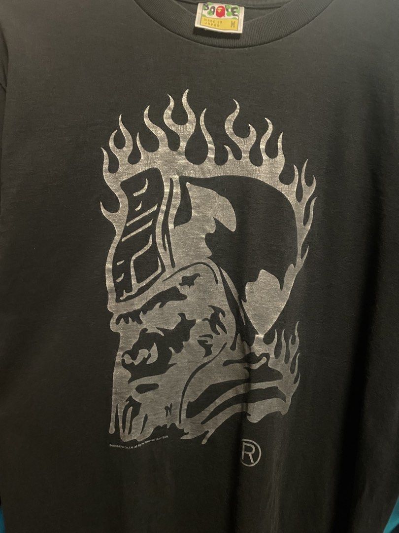 AUTHENTIC A Bathing Ape Flame Ape Head Graphic T-Shirt (Category: Tshirts & Polo Shirts ) located in Davao. Submitted by loythrift30 (Listing ID 1465524814, Image 2). Description: - Brand: A Bathing Ape (BAPE) - Color: Black - Size: Medium (M) - Material: 100% Cotton - Origin: Made in Japan - Design: Large silver flaming ape head graphic on front, small back collar branding.
