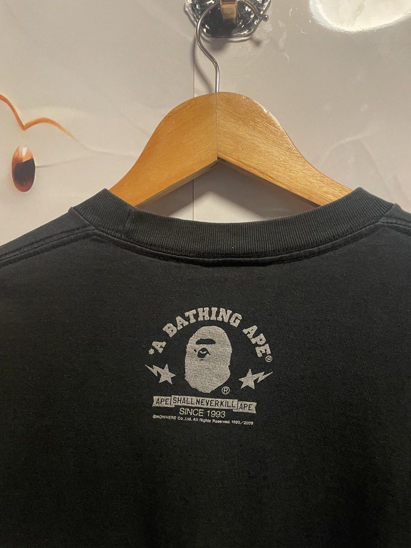 AUTHENTIC A Bathing Ape Flame Ape Head Graphic T-Shirt (Category: Tshirts & Polo Shirts ) located in Davao. Submitted by loythrift30 (Listing ID 1465524814, Image 3). Description: - Brand: A Bathing Ape (BAPE) - Color: Black - Size: Medium (M) - Material: 100% Cotton - Origin: Made in Japan - Design: Large silver flaming ape head graphic on front, small back collar branding.