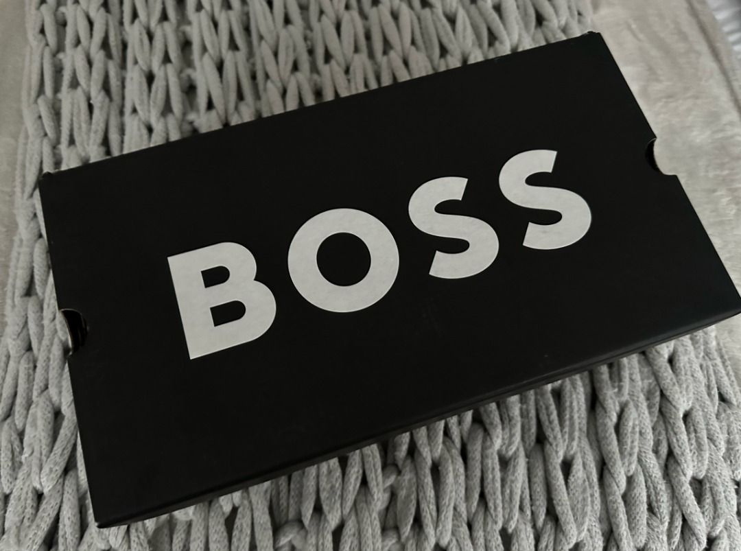 Authentic BOSS Shoe Box (Category: Sneakers) located in San Juan City. Submitted by flipandfind (Listing ID 1465410823, Image 1). Description: - Authentic black Hugo Boss empty box - Bold white Boss logo on top lid - Clean interior and exterior with brown cardboard inside - Features official website and FSC recycling icons on the bottom - Ideal for gift packaging, storage, or collecting.