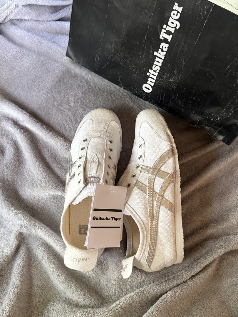 [25CM] Authentic Onitsuka Tiger Mexico 66 Slip-On White/Silver (Category: Sneakers) located in Caloocan City. Submitted by lovedbyzee (Listing ID 1465518816, Image 1). Description: ₊˚⊹♡ ➔ Size: US 6.5 // 25CM ₊˚⊹♡ ➔ 100% brand new, no issues! ₊˚⊹♡ ➔ Comes with original paper bag ₊˚⊹♡ ➔ NEGOTIABLE for sure buyers 🤍 ₊˚⊹♡ ➔ RFS: Doesn’t fit me, and I already bought a replacement pair. ₊˚⊹♡ ➔ Note: No shoe box included as it was left behind at the J