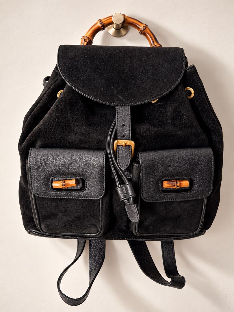 Authentic Vintage Gucci Bamboo Suede Backpack – Black (Category: Luxury Bags & Wallets) located in Makati City. Submitted by thecloset.edit.ph (Listing ID 1465416270, Image 1). Description: A beautiful vintage Gucci piece featuring the house’s iconic bamboo detailing. Crafted in black suede with leather trims, gold-tone hardware, and a structured bamboo top handle. This is the larger backpack style with two front pockets and bamboo accents — a cl