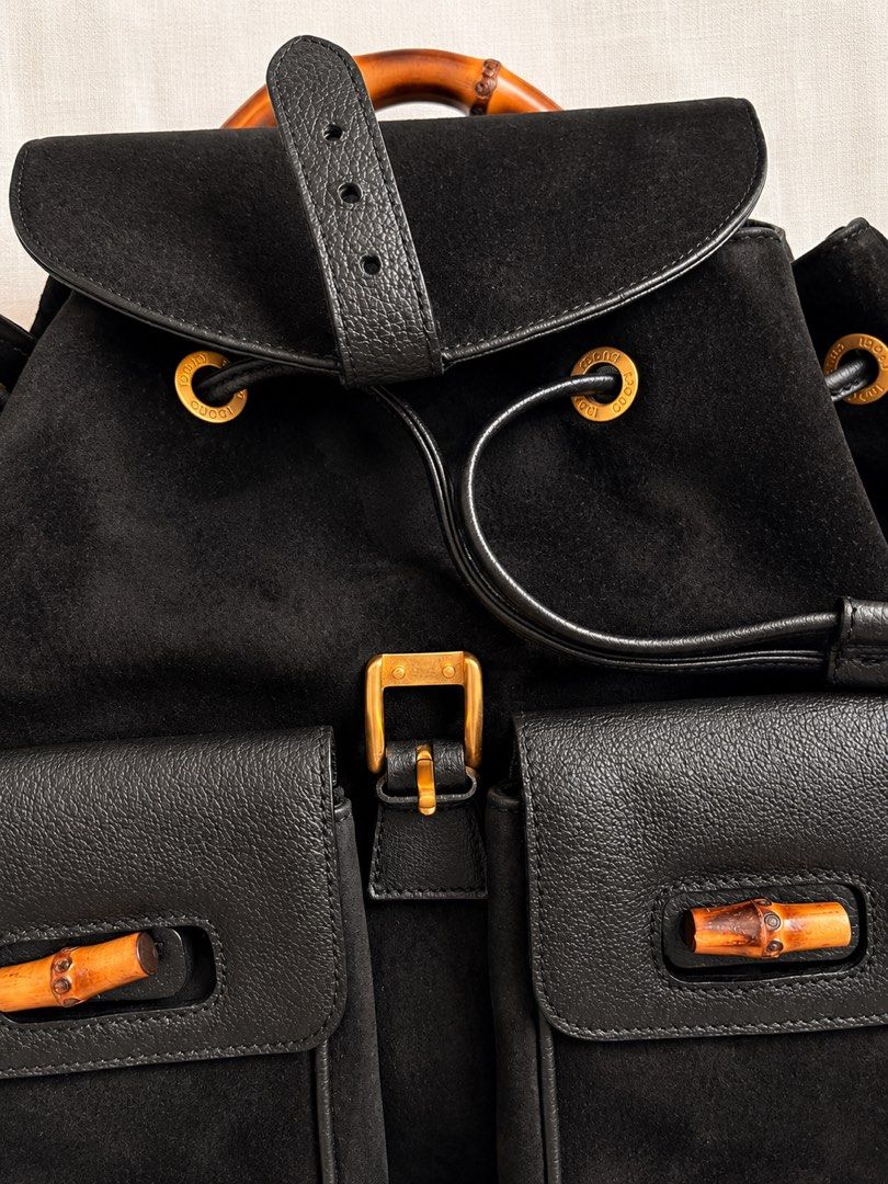 Authentic Vintage Gucci Bamboo Suede Backpack – Black (Category: Luxury Bags & Wallets) located in Makati City. Submitted by thecloset.edit.ph (Listing ID 1465416270, Image 2). Description: A beautiful vintage Gucci piece featuring the house’s iconic bamboo detailing. Crafted in black suede with leather trims, gold-tone hardware, and a structured bamboo top handle. This is the larger backpack style with two front pockets and bamboo accents — a cl
