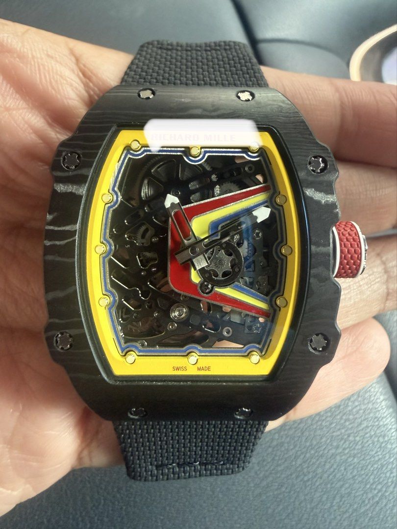 Automatic watch (Category: Watches) located in Singapore. Submitted by rareearth-e1ac (Listing ID 1465403276, Image 1). Description: Automatic Thin Watch 39mm - Case: Lightweight Black NTPT Carbon with exhibition case back. - Dial: Skeleton dial featuring a yellow inner flange, red and yellow graphic accents. - Movement: automatic movement with moving gear at 7oclock. - Strap: Textured black strap with a subtle red crown detail. - Deal method: Me