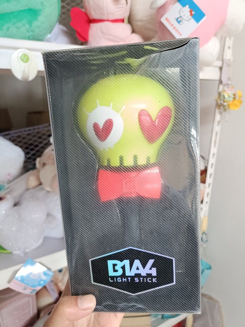 B1A4 Official Light Stick in Box (Category: K-Wave Merchandise) located in Baguio. Submitted by jamela.joy.shoppe15 (Listing ID 1465449725, Image 3). Description: - NOT WORKING FOR DISPLAY PURPOSES ONLY ‼️ - Iconic green skull head design with heart eyes and red bow tie - Authentic merchandise with official WM Entertainment and Rainbow Bus branding - Perfect for collectors .