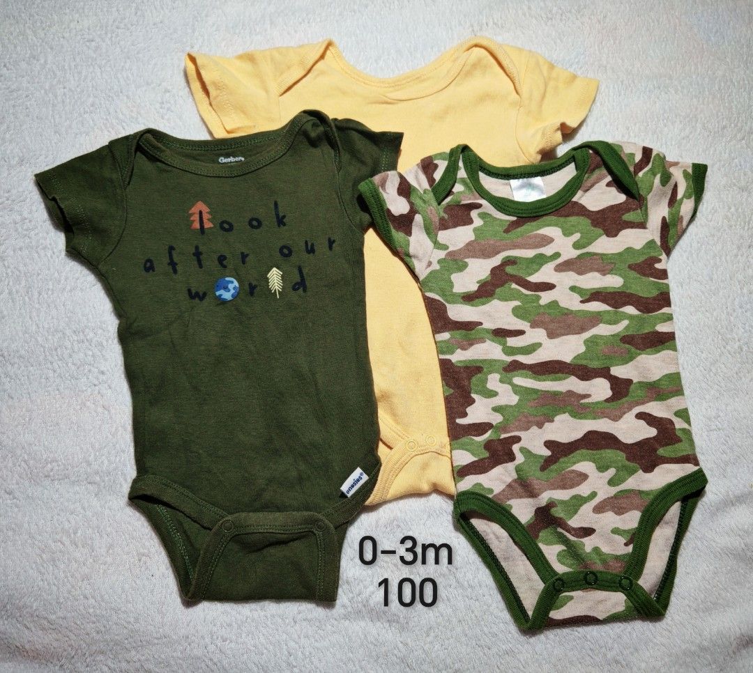 Baby Onesies Bodysuits 0-3 Months (Category: Babies & Kids Fashion) located in Quezon City. Submitted by maypamor (Listing ID 1465466600, Image 1). Description: - Brand: Gerber - Size: 0-3 months - Set includes: 3 short-sleeve bodysuits (solid yellow, green with "look after our world" earth graphic, and green camo) - Features: Bottom snaps for easy diaper changes - Material: Soft, breathable cotton.